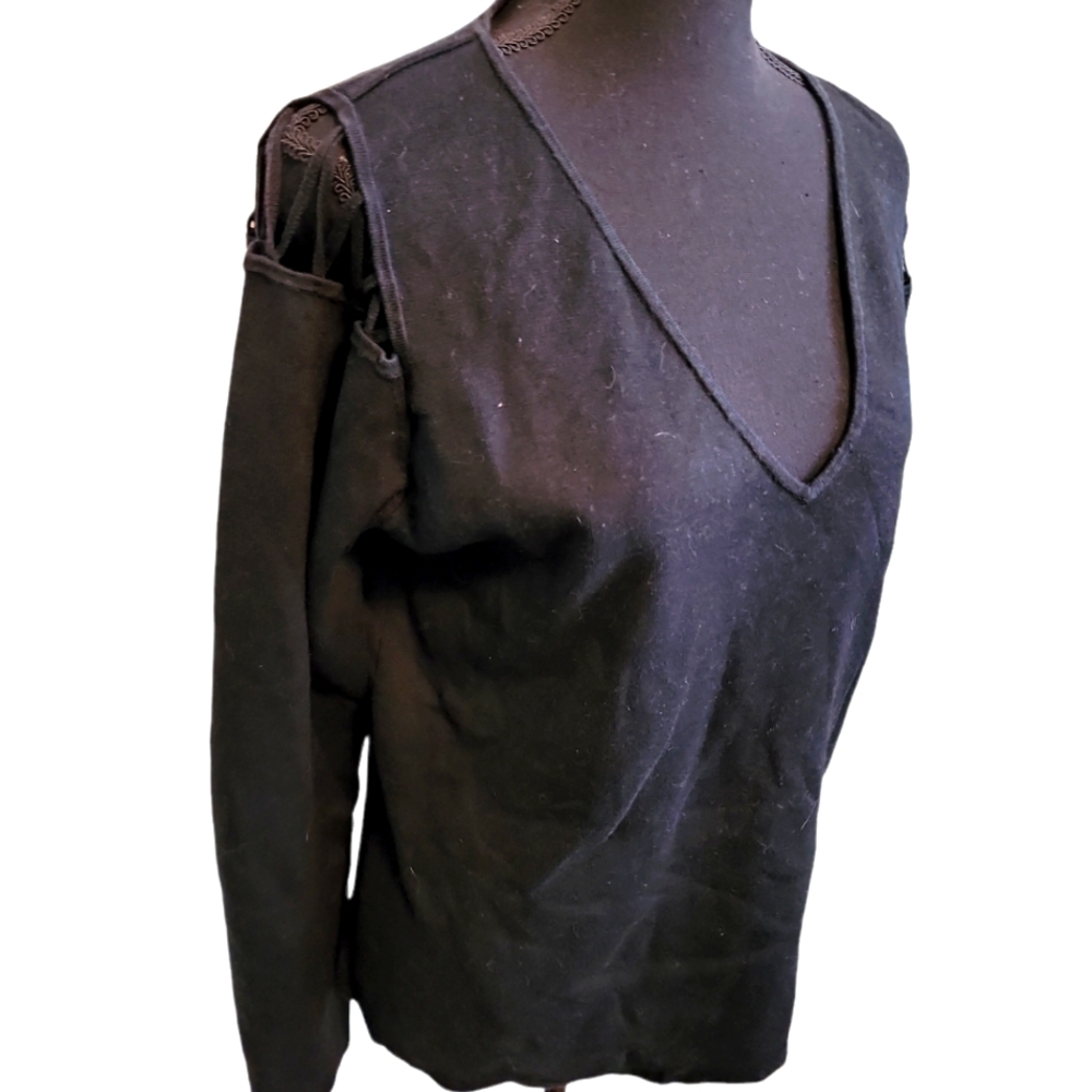 FREE W/$20+ PURCHASE.  Not your ordinary V-neck sweater! Cold shoulder.
